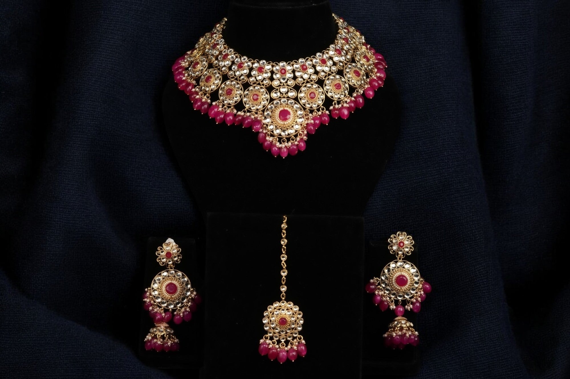 A rose pink and golden traditional kundan set