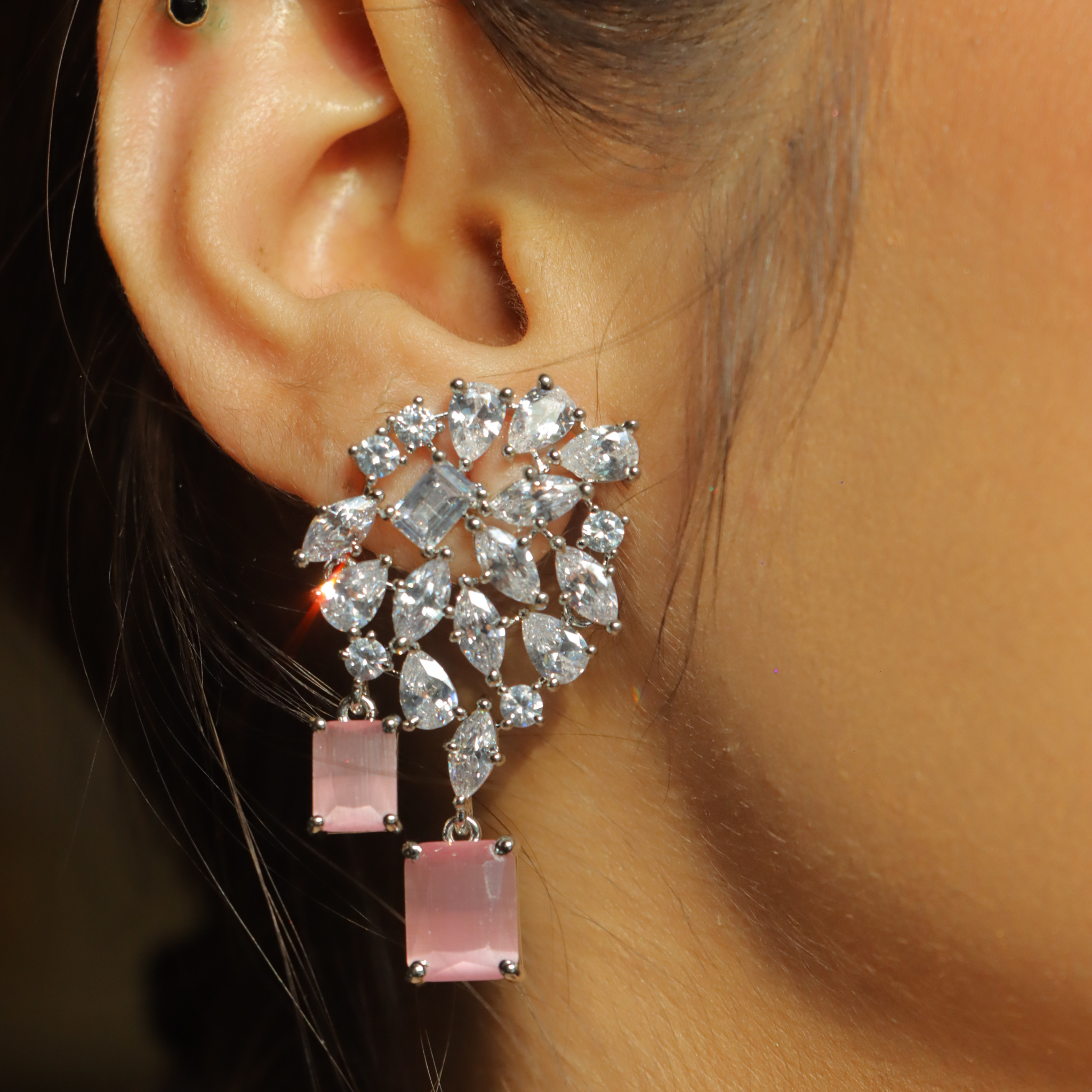 diamond cluster earrings with baby pink gemstones hanging