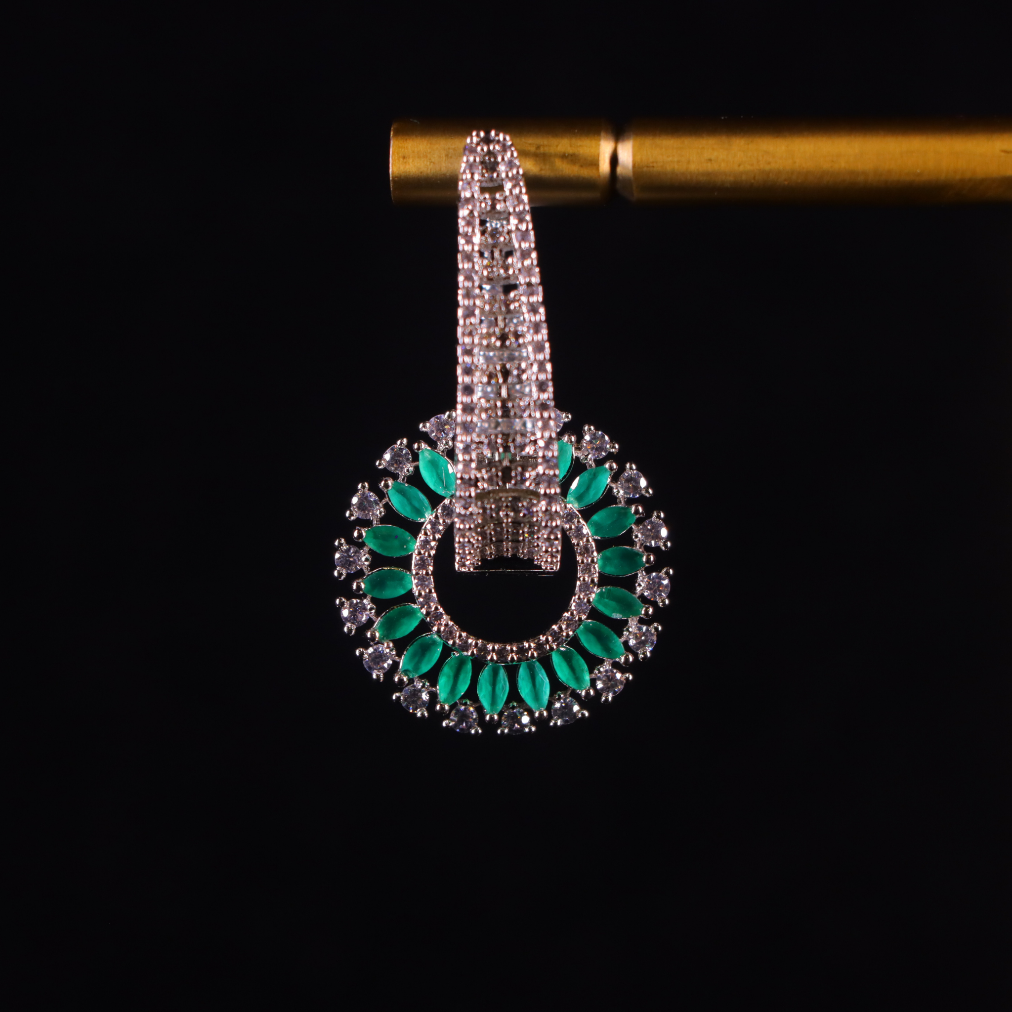 silver diamond earrings with emerald accents
