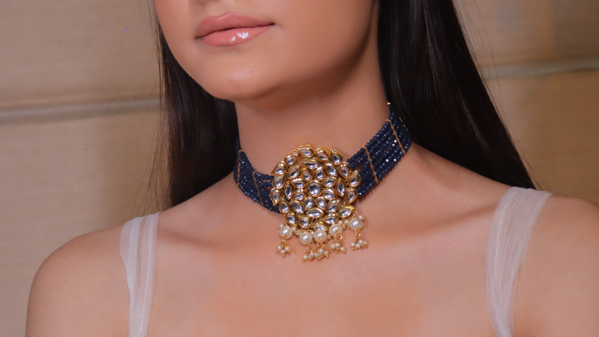 blue and gold choker neckpiece with a radiant Kundan finish