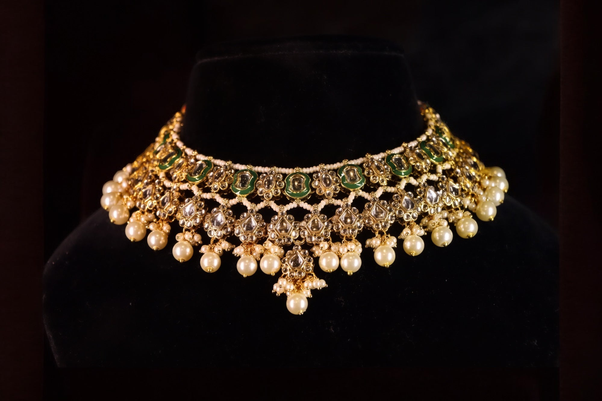 green embellishments on kundan necklace set with white dangling pearls