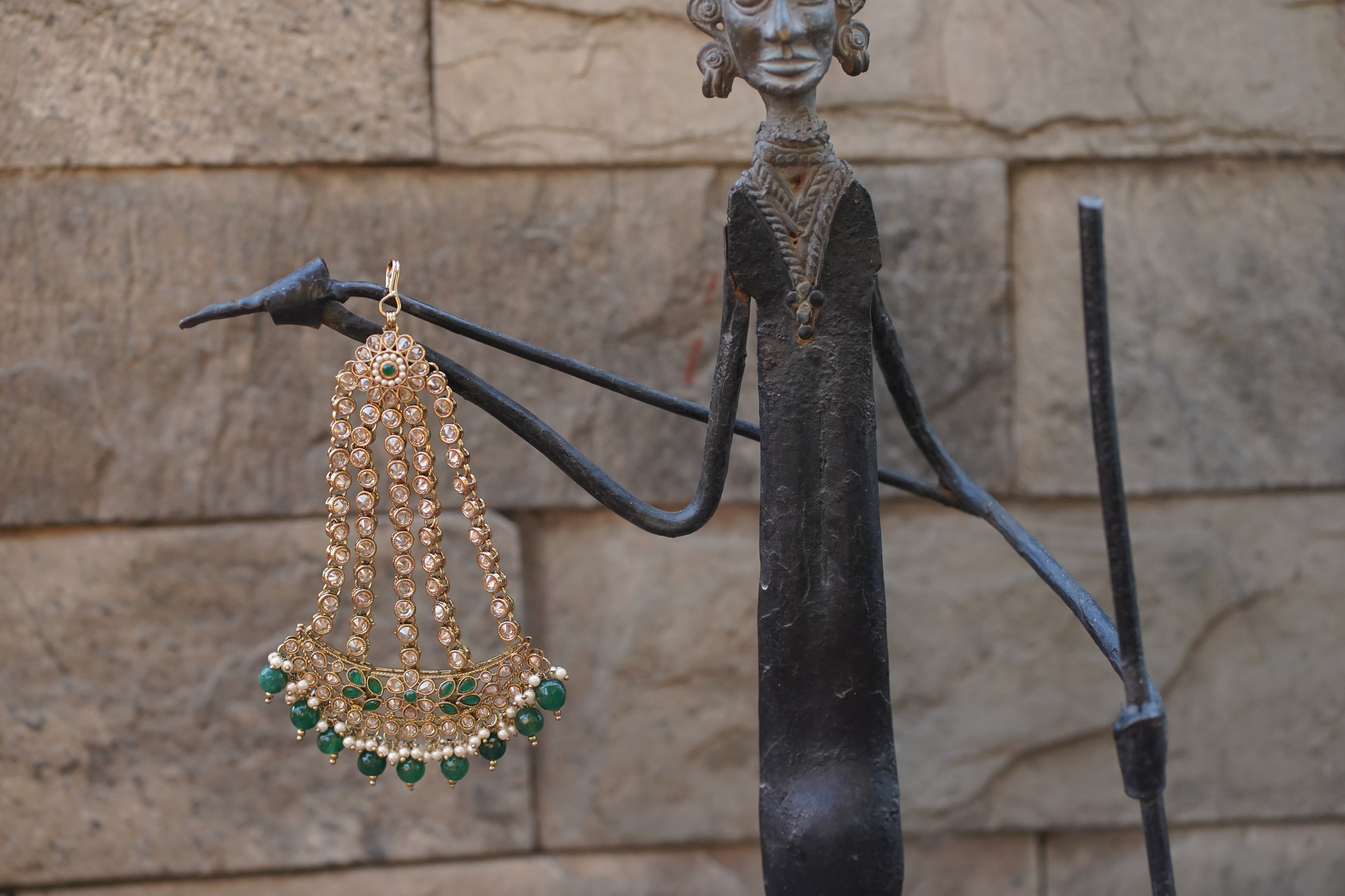 gold kundan passa with emerald stones and pearls