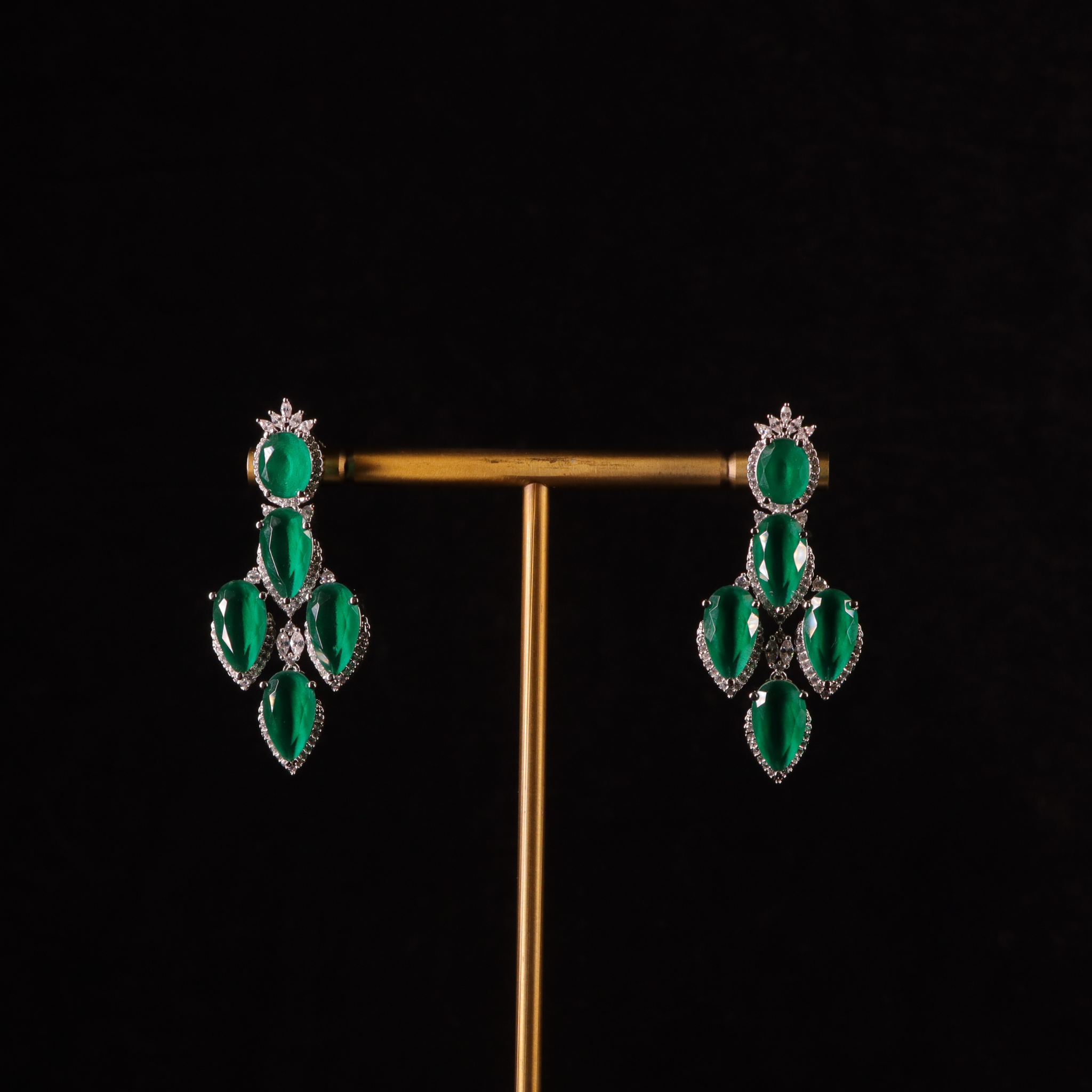 A pair of emerald green and silver-diamond earrings