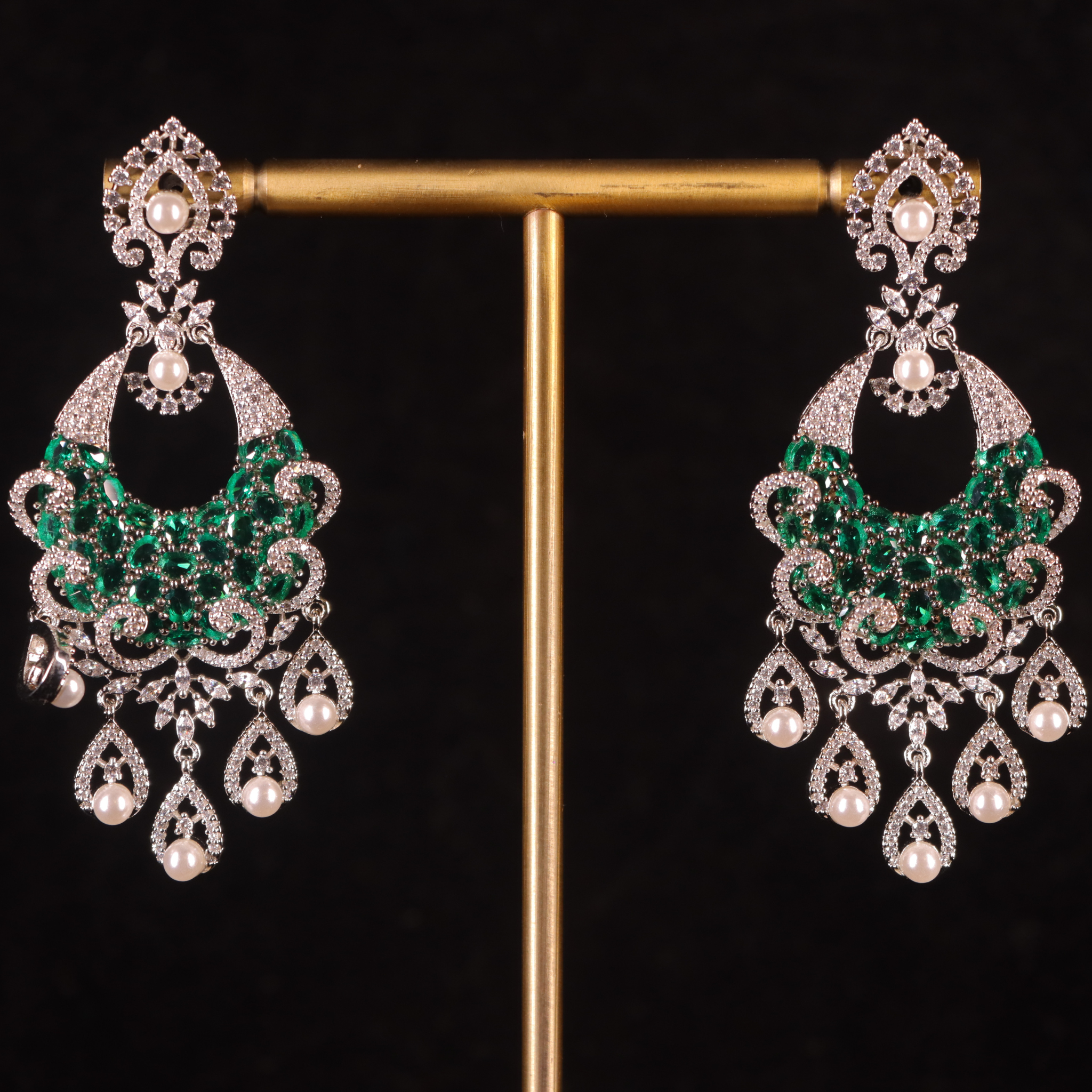 emerald green and white pair of earrings for formal occassions