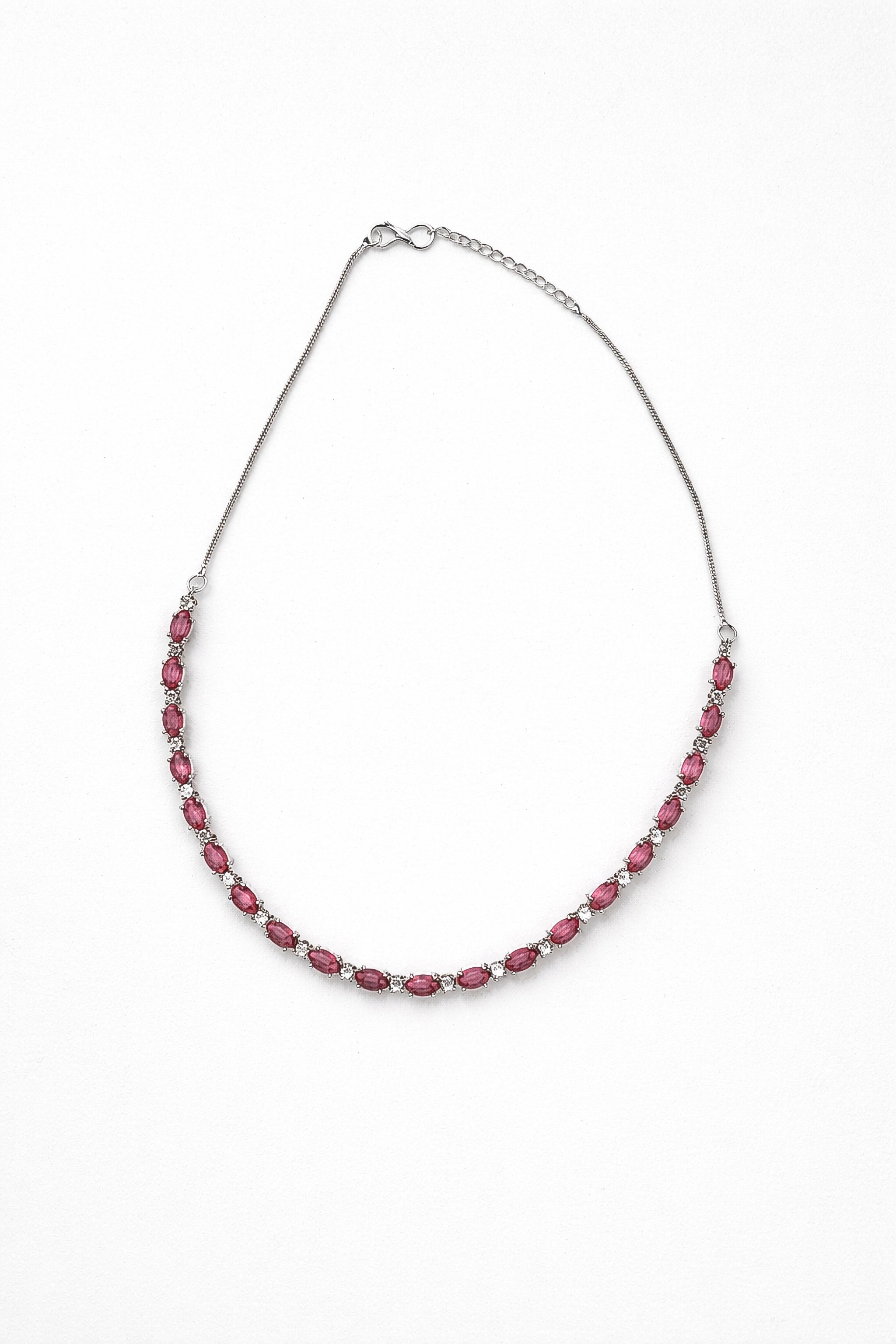 Necklace with pink beads on a white background