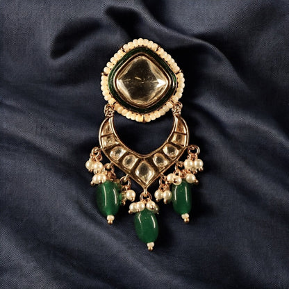 kundan earrings with green emerald stone accents and intricate craftsmanship
