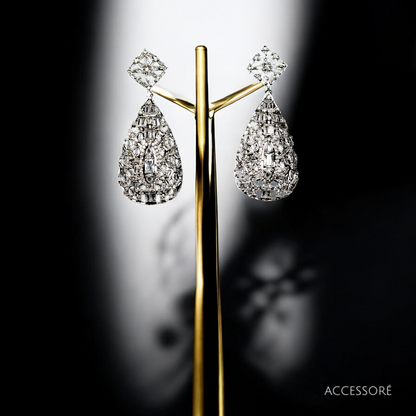 A pair of white glass diamond earrings in a geometric pattern