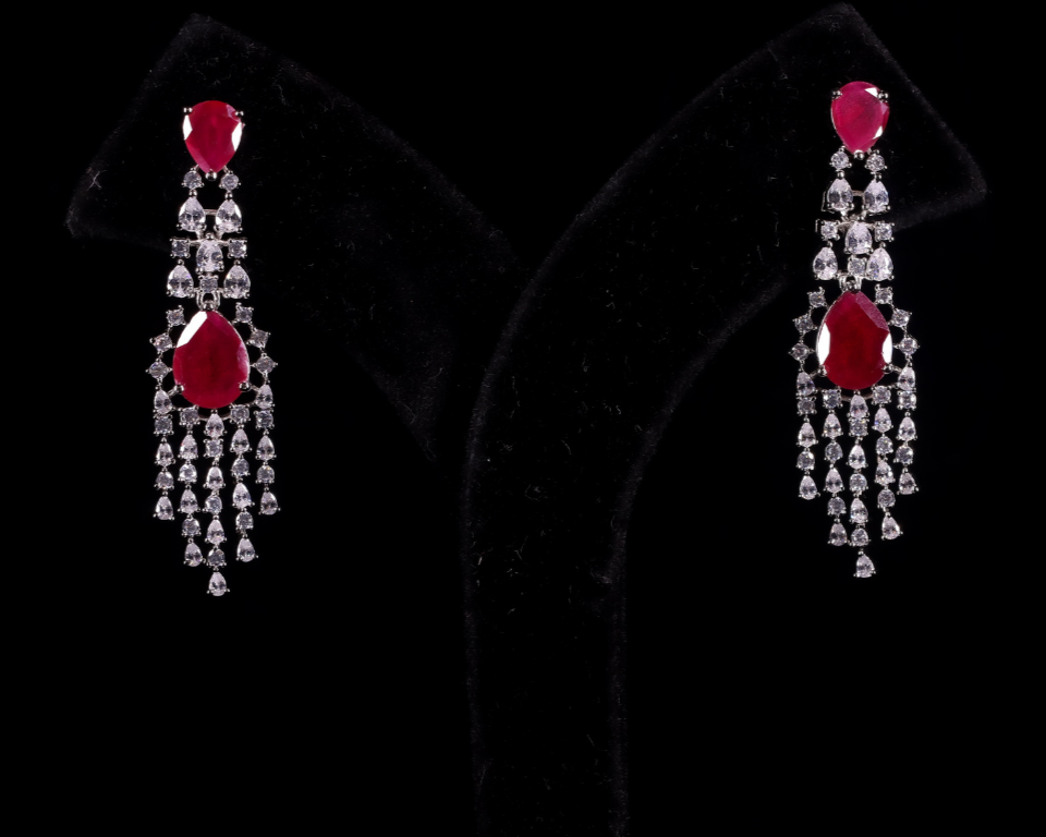 Pair of pink ruby gemstone earrings with diamond accents