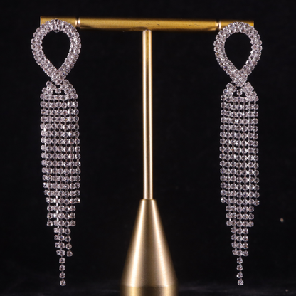 elegant party earrings that feature a series of sparkling diamond tiers cascading elegantly from the ear